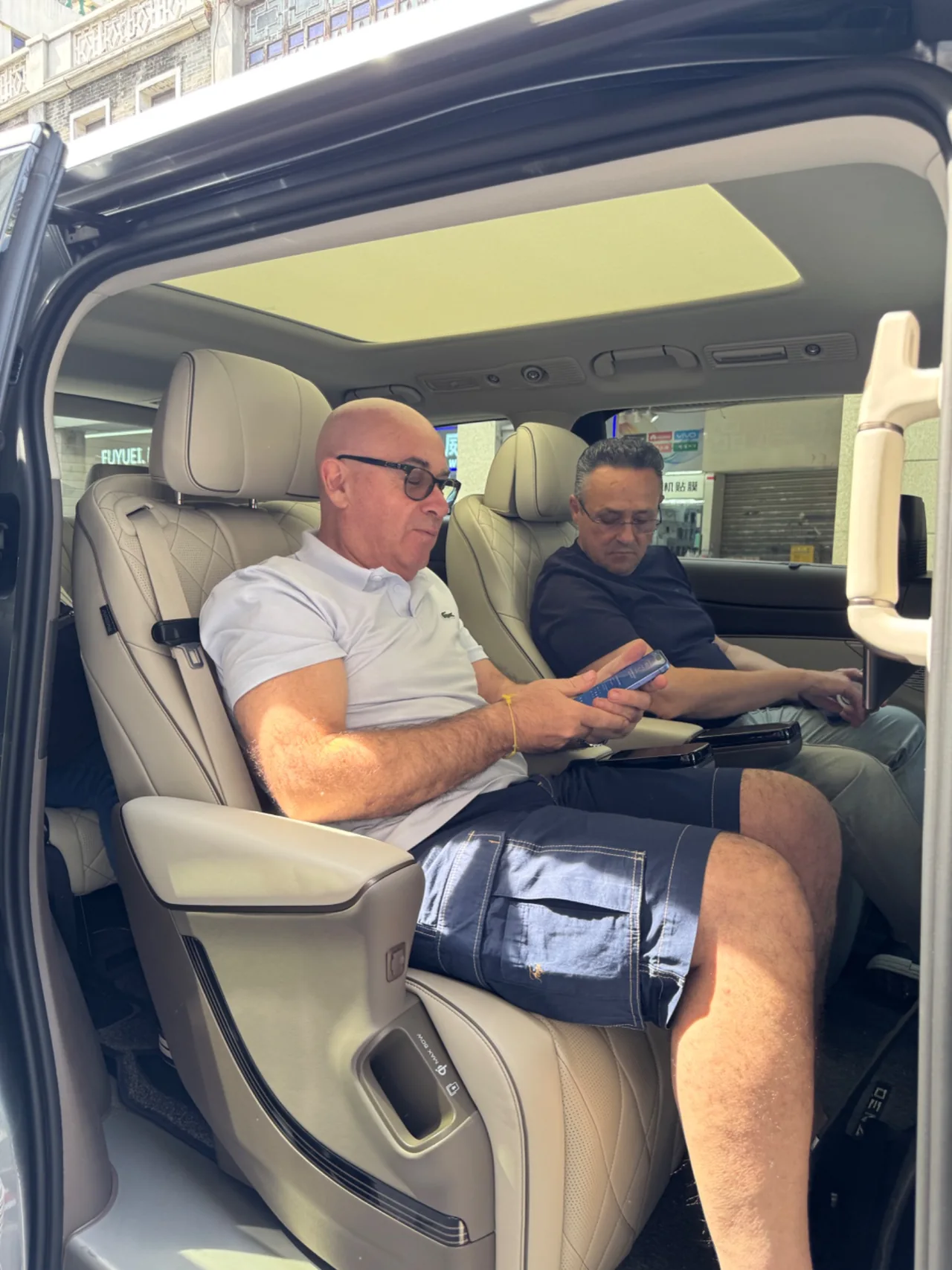 Guests seated in a passenger vehicle