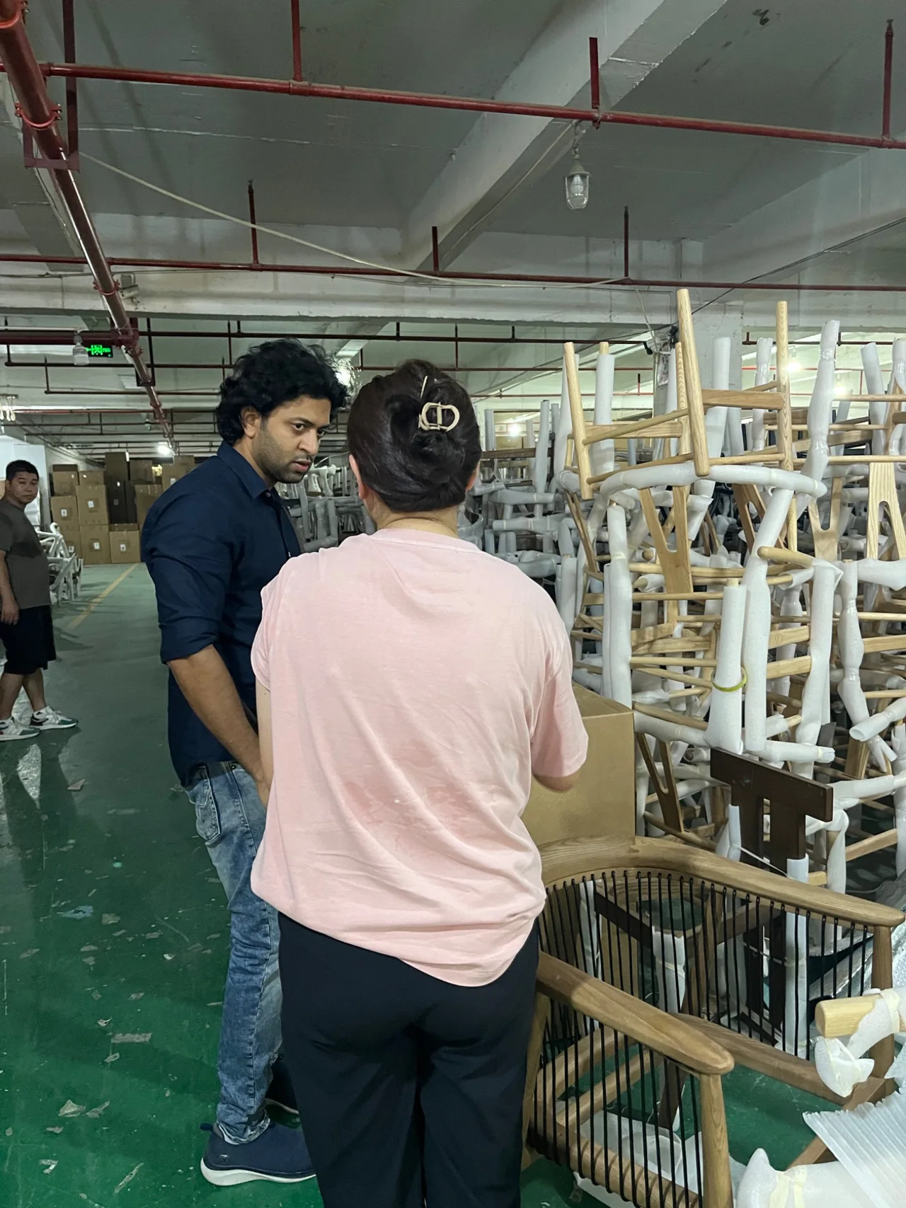 Visitors discussing production in a workshop